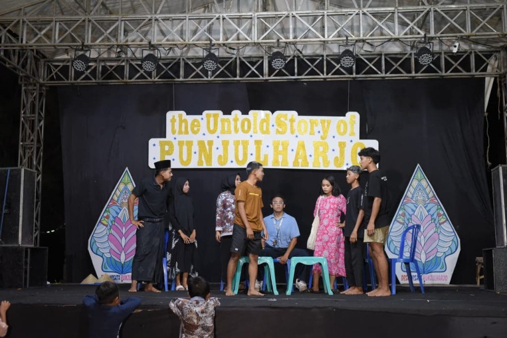 A group of people on a stage AI-generated content may be incorrect.