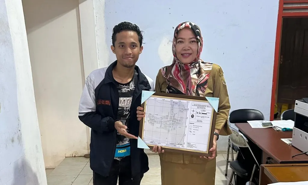Penyerahan Peta Penomoran Rumah Desa Wangandowo di Balai Desa Wangandowo